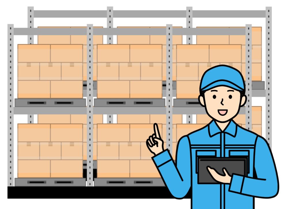 商品倉庫の棚の前で作業をしている人の画像
